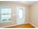 Bright entryway with hardwood floors, a glass-paneled door, and a window providing natural light at 617 Conover Rd, Durham, NC 27703