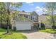 Charming two-story home with a two-car garage, stone accents, and well-maintained landscaping at 617 Conover Rd, Durham, NC 27703