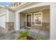 Covered front porch featuring stone accents, a dark wood front door, and a welcoming entrance area at 617 Conover Rd, Durham, NC 27703