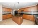 Charming kitchen with wood cabinets, an island, and modern lighting fixtures at 617 Conover Rd, Durham, NC 27703