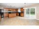 Well-appointed kitchen with wooden cabinets, a center island, and stainless steel appliances at 617 Conover Rd, Durham, NC 27703