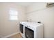 Laundry room area equipped with modern, front-load washer and dryer at 617 Conover Rd, Durham, NC 27703