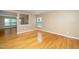 Spacious living room with hardwood floors, a pass-through to another room, and neutral wall colors at 617 Conover Rd, Durham, NC 27703