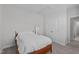 Cozy bedroom features neutral walls, a bed, carpet and a wardrobe at 633 Democracy St, Raleigh, NC 27603