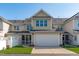 Charming townhouse features a spacious garage and neatly manicured lawn at 633 Democracy St, Raleigh, NC 27603