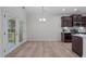 Modern kitchen with stainless steel appliances, granite countertops, and adjoining dining area at 633 Democracy St, Raleigh, NC 27603