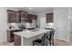 Modern kitchen with stainless steel appliances, granite countertops, and breakfast bar seating at 633 Democracy St, Raleigh, NC 27603
