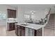 Modern kitchen island with stainless steel appliances, granite countertops, and stylish cabinetry at 633 Democracy St, Raleigh, NC 27603