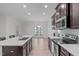 Modern kitchen featuring stainless steel appliances, granite countertops, and a spacious island at 633 Democracy St, Raleigh, NC 27603
