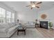 Cozy living room with fireplace, hardwood floors, and comfortable seating at 633 Democracy St, Raleigh, NC 27603