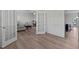 View of the open-concept living room showcasing hardwood floors, modern design, and seamless flow at 633 Democracy St, Raleigh, NC 27603