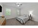 Cozy bedroom with carpet floors, natural light, and ceiling fan at 64 Thousand Oaks Ct, Clayton, NC 27527