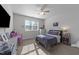 Cozy bedroom featuring a window that allows in sunlight, and neutral colored walls and carpet at 64 Thousand Oaks Ct, Clayton, NC 27527