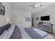 Bedroom with neutral walls, a ceiling fan, and a cozy, comfortable bed setup at 64 Thousand Oaks Ct, Clayton, NC 27527