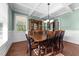 Dining area with a hutch cabinet, a wooden table, and great window light at 64 Thousand Oaks Ct, Clayton, NC 27527