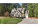 Beautiful exterior view highlighting the home's architecture, driveway, and well-maintained yard at 64 Thousand Oaks Ct, Clayton, NC 27527