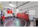 Spacious garage converted to a home gym, complete with a wrestling mat and exercise equipment at 64 Thousand Oaks Ct, Clayton, NC 27527