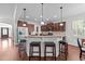 Well-equipped kitchen with stainless steel appliances, granite countertops, and ample cabinet space at 64 Thousand Oaks Ct, Clayton, NC 27527