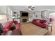 Cozy living room with a stone fireplace, built-in shelves, and comfortable seating at 64 Thousand Oaks Ct, Clayton, NC 27527