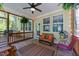 Cozy screened porch with a ceiling fan and views of the wooded backyard at 64 Thousand Oaks Ct, Clayton, NC 27527