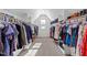 Large walk-in closet offering ample hanging and shelf storage solutions for clothing and accessories at 64 Thousand Oaks Ct, Clayton, NC 27527