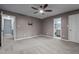Spacious bedroom features a ceiling fan and ensuite bathroom access at 6568 English Oaks Dr, Raleigh, NC 27615