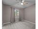 Cozy bedroom with neutral walls, carpet, ceiling fan, and window with curtains at 6568 English Oaks Dr, Raleigh, NC 27615