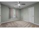 Cozy bedroom with ceiling fan and window allowing natural light at 6568 English Oaks Dr, Raleigh, NC 27615
