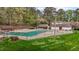 Aerial view of the community pool and amenities in a wooded neighborhood at 6568 English Oaks Dr, Raleigh, NC 27615