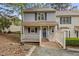 Charming home featuring a welcoming front porch, neutral siding, and well-maintained landscaping at 6568 English Oaks Dr, Raleigh, NC 27615