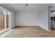 Open-concept living room with bright paint, ceiling fan and sliding glass door at 6568 English Oaks Dr, Raleigh, NC 27615