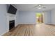 Bright living room with fireplace and patio access with sliding glass door at 6568 English Oaks Dr, Raleigh, NC 27615