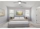 Serene main bedroom with plush carpeting, soft lighting, and natural light highlighting a comfortable bed at 6863 Paint Rock Ln, Raleigh, NC 27610