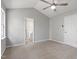 Spacious main bedroom featuring neutral paint, carpet, ceiling fan, and ensuite bathroom for added convenience at 6863 Paint Rock Ln, Raleigh, NC 27610
