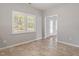 Bright, airy room with large windows, tile flooring and neutral wall color at 6863 Paint Rock Ln, Raleigh, NC 27610