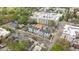 Aerial view of new construction townhomes in an urban area, surrounded by trees at 700 W North St # 101, Raleigh, NC 27603