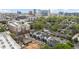 Stunning aerial view of new construction townhomes in a vibrant city neighborhood with lush trees and modern architecture at 700 W North St # 101, Raleigh, NC 27603