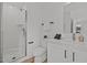 Well-lit bathroom with a walk-in shower, white subway tile, and modern vanity at 700 W North St # 101, Raleigh, NC 27603