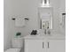 Elegant bathroom with a white vanity, modern fixtures, and a pristine white color palette at 700 W North St # 101, Raleigh, NC 27603