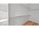 An empty closet with wooden floors and adjustable shelving awaits personalization at 700 W North St # 101, Raleigh, NC 27603