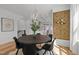 Dining room with a black round table, six chairs, and a unique light fixture at 700 W North St # 101, Raleigh, NC 27603