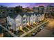 New townhome row with well manicured yards and landscaping, and convenient parking, offering curb appeal at 700 W North St # 101, Raleigh, NC 27603