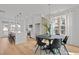 Open floor plan showcasing the kitchen island and a dining area with a round table at 700 W North St # 101, Raleigh, NC 27603