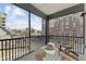 Relaxing screened porch with comfortable seating and a city view at 700 W North St # 101, Raleigh, NC 27603