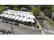 Aerial shot of multi-unit dwelling featuring unique roofline and easy access to city streets at 701 W Trinity Ave # 116, Durham, NC 27701