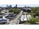 Aerial view showcasing the neighborhood with a view of the city skyline in the background at 701 W Trinity Ave # 116, Durham, NC 27701