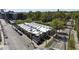 Street-level aerial view shows surrounding city neighborhood with mature landscaping and easy access to city streets at 701 W Trinity Ave # 116, Durham, NC 27701