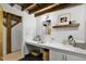 Rustic bathroom featuring exposed beams, a large vanity, and stylish decor at 701 W Trinity Ave # 116, Durham, NC 27701