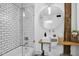 Modern bathroom with subway tile shower and a stylish round mirror at 701 W Trinity Ave # 116, Durham, NC 27701