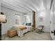 Bright bedroom featuring a bed and modern decor at 701 W Trinity Ave # 116, Durham, NC 27701